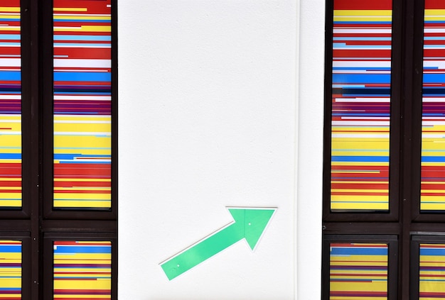 A graphic showing an upward trending arrow representing rising tuition costs. The arrow is overlaid on an image of a student studying in a library.