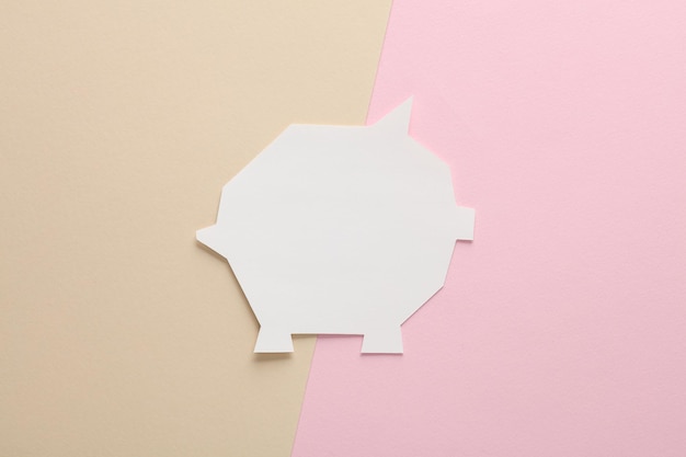 A split image showing a piggy bank on one side representing savings and a financial aid form on the other. The image conveys the balance between saving and seeking aid.