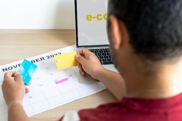 A student meticulously organizing a calendar with application deadlines, test dates, and essay milestones. Post-it notes are attached, each highlighting a crucial task, emphasizing the importance of timely execution.