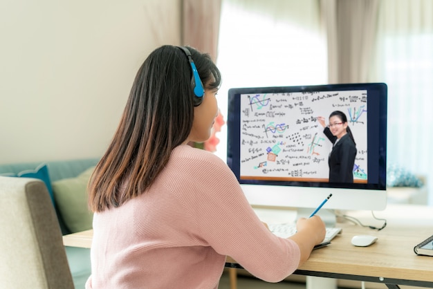 A split-screen showing a student participating in an online tutoring session on one side, and a student working through practice questions on a tablet on the other side. This visually represents the use of diverse online resources and tools for effective test preparation.