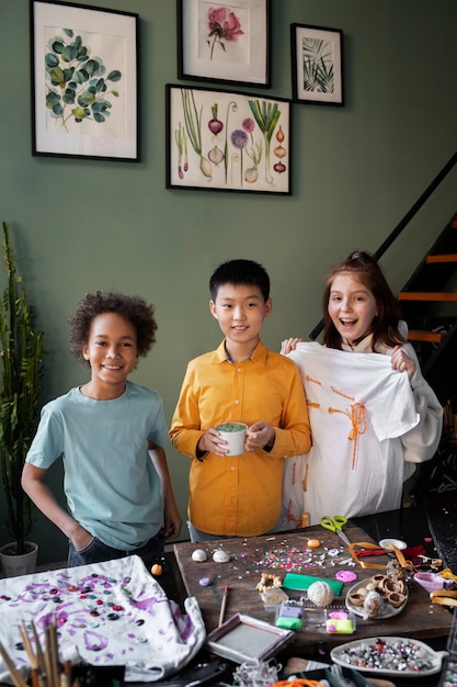 A group of young children, from diverse backgrounds, working together on a collaborative art project, smiling and laughing. The environment is engaging and supportive.
