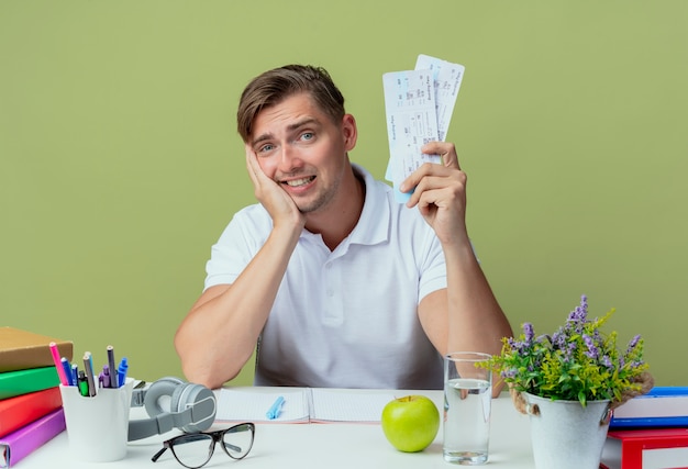 A person happily tearing up a student loan bill, symbolizing the relief and freedom gained from successful loan repayment.