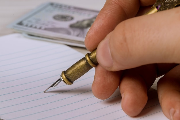 A close-up shot of a hand holding a retirement income statement, with a pen pointing towards the total benefit amount. The image is cropped to focus on the key financial details and convey the importance of understanding income sources.