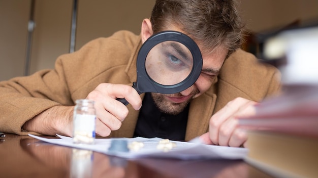 A person holding a magnifying glass over a credit report, focusing on examining the details and looking for errors or discrepancies.