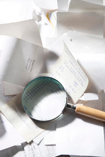 A close-up shot of a magnifying glass over a document titled 