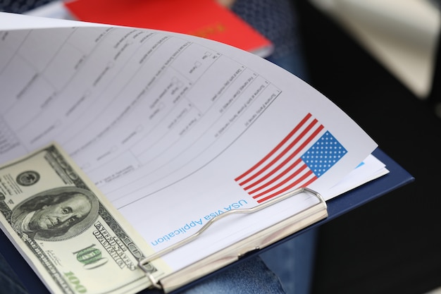 A close-up of a document resembling a US Treasury bond certificate, with visible security features and official seals. The image focuses on the words 