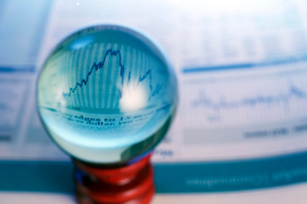 A close-up of a financial analyst examining stock charts with a magnifying glass, highlighting the research involved in growth stock investing