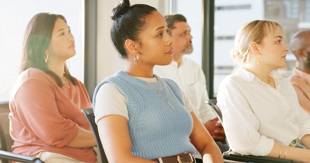 Employees attending a workshop, actively participating and engaging with the instructor, reflecting the diverse training opportunities available through company benefits.