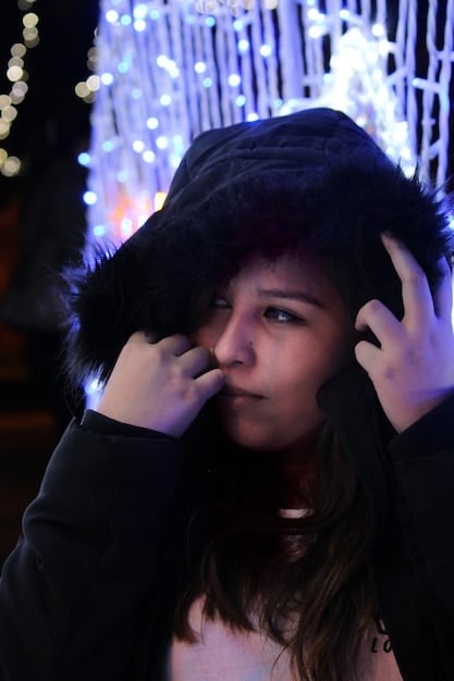 A close-up shot of a K-Pop idol acting in a dramatic scene from a Korean drama. The idol is expressing a deep emotion with tearful eyes and a concerned expression. The background is slightly blurred, focusing the viewer's attention on the idol's emotional performance.