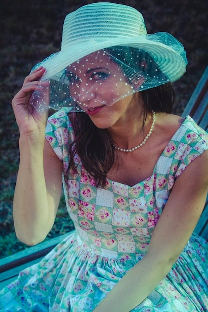A detailed close-up of a young woman's outfit in Mexico. She is wearing a pastel pink dress inspired by K-dramas, paired with white sneakers and delicate jewelry. The setting is a brightly lit café with floral decorations.