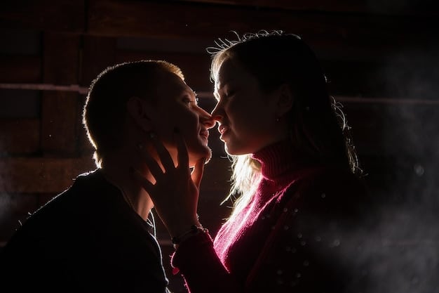 A close-up shot of two actors during a kissing scene rehearsal. The focus is on their faces, showing the expressions and intimacy. The setting is a well-lit rehearsal room with minimal distractions.