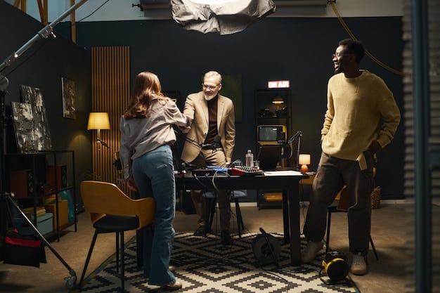 A meeting scene with a diverse group of people (director, actors, cinematographers) sitting around a table reviewing storyboards. The producer executive is leading the discussion, pointing at a storyboard.