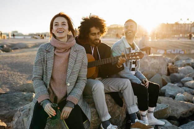 A candid shot of a young migrant playing a guitar during sunset, with a group of companions listening attentively. The scene captures the camaraderie and moments of respite amidst their difficult journey.