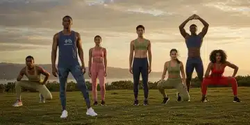 Athletes in sustainable fitness wear exercising outdoors